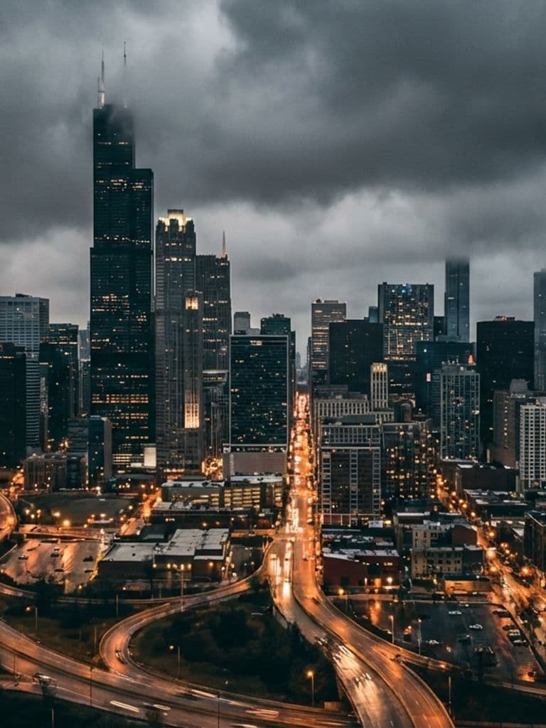 Moody aerial view of Chicago skyline at night for a true crime documentary.